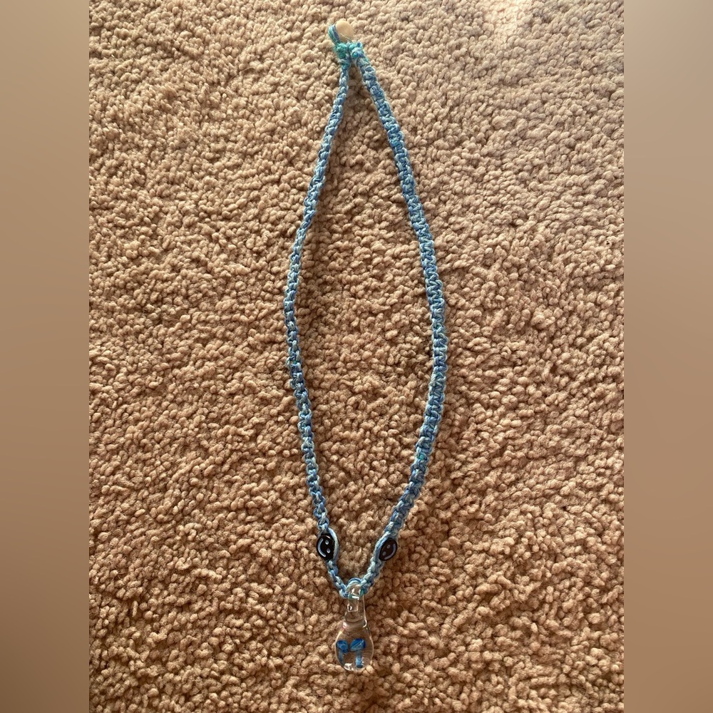 Mushroom pendant necklace.